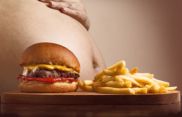 image of hamburger and obese man