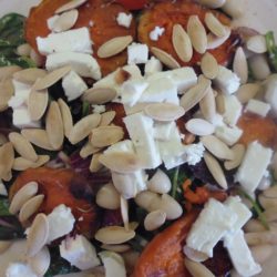 photo of Warm sweet potato salad, with feta cheese, spinach, rocket, beans and tomatoes